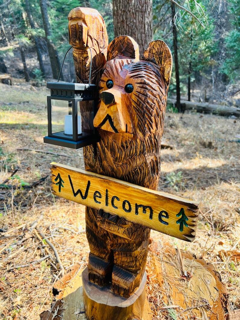 3ft cedar carved bear on stump with solar lantern and welcome sign