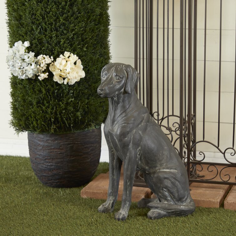A charming dog garden sculpture