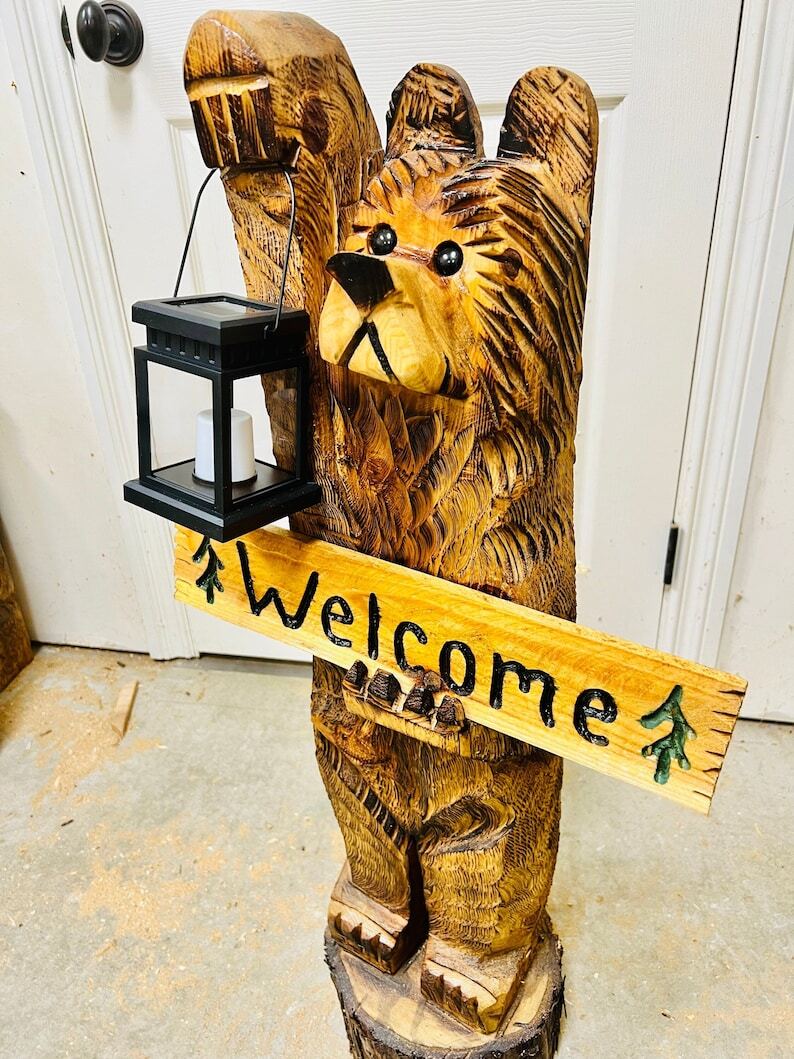 3ft cedar carved bear on stump with solar lantern and welcome sign