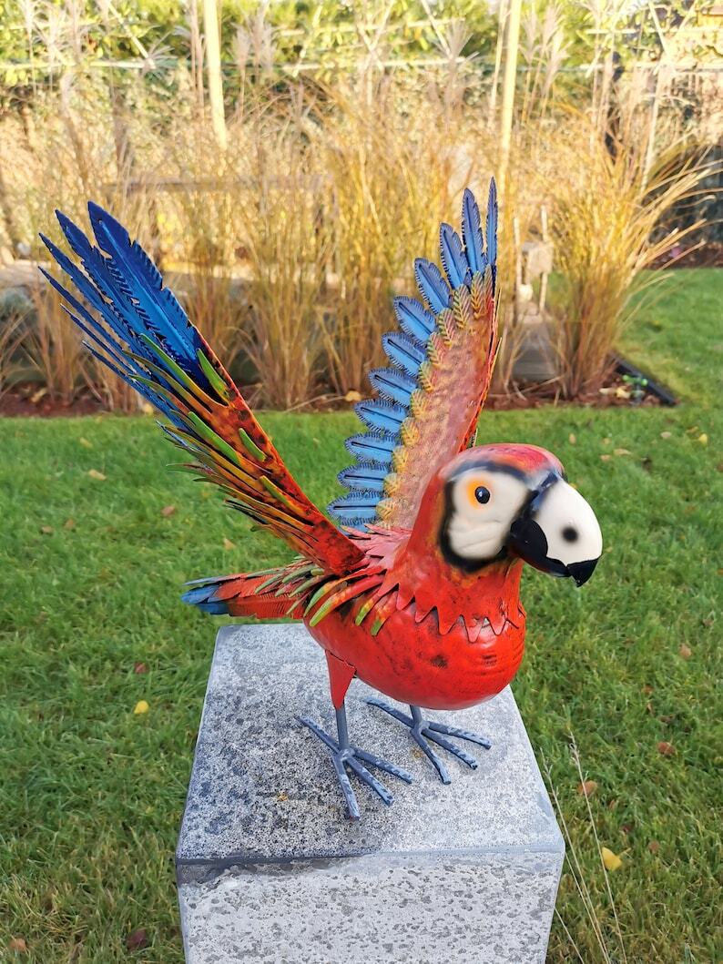 Colorful red and blue parrot ( Garden Sculpture)
